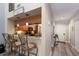 Modern kitchen with wood cabinets, stainless steel appliances, and a breakfast bar with seating at 1912 Harbourside Dr # 602, Longboat Key, FL 34228