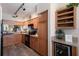 Charming kitchen features wood cabinets, modern appliances, and a lovely wine rack with beverage cooler at 1912 Harbourside Dr # 602, Longboat Key, FL 34228