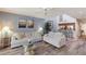 Inviting living room with wood floors, comfortable sofas, and beach-themed artwork at 1912 Harbourside Dr # 602, Longboat Key, FL 34228