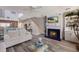Open living room showcasing a fireplace and coastal decor at 1912 Harbourside Dr # 602, Longboat Key, FL 34228