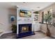 Bright living room featuring a fireplace with coastal decor at 1912 Harbourside Dr # 602, Longboat Key, FL 34228