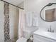 Bathroom featuring a modern vanity, shower with decorative tile and neutral accents at 2001 25Th W Ave, Bradenton, FL 34205
