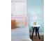 The bedroom features a blue accent wall, white shutters, and a blue side table at 2001 25Th W Ave, Bradenton, FL 34205
