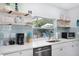Bright kitchen with quartz countertops, stainless appliances, and tiled backsplash at 2001 25Th W Ave, Bradenton, FL 34205
