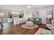 Open-concept living room and kitchen with hardwood floors, modern decor, and plenty of natural light at 2001 25Th W Ave, Bradenton, FL 34205