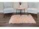 Cozy sitting area featuring patterned chairs, a small table, and a plush rug on hardwood floors at 2001 25Th W Ave, Bradenton, FL 34205