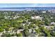 Scenic aerial shot of a vibrant neighborhood with lush trees, a river and city views at 2003 12Th W Ave, Bradenton, FL 34205