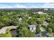 Beautiful aerial view of a home surrounded by lush greenery and cityscape in the distance at 2003 12Th W Ave, Bradenton, FL 34205