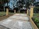 The backyard landscape includes stone steps leading to a serene outdoor living area at 2003 12Th W Ave, Bradenton, FL 34205