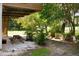 Lush backyard with a picnic table and tropical landscaping, perfect for outdoor entertaining at 2003 12Th W Ave, Bradenton, FL 34205