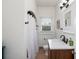Bright bathroom with shower, window, and sink vanity at 2003 12Th W Ave, Bradenton, FL 34205