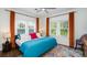 Bright bedroom with windows, ceiling fan, and colorful rug at 2003 12Th W Ave, Bradenton, FL 34205