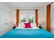 Bright bedroom with windows and colorful accents at 2003 12Th W Ave, Bradenton, FL 34205