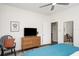 Comfortable bedroom with TV, dresser, and chair at 2003 12Th W Ave, Bradenton, FL 34205