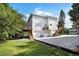 Spacious two-story home featuring a two-car garage, wooden decks, and a gravel driveway at 2003 12Th W Ave, Bradenton, FL 34205