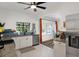 Bright eat-in kitchen with stainless steel appliances, granite countertops, white cabinets, and a window view at 2003 12Th W Ave, Bradenton, FL 34205