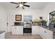 Updated kitchen featuring white cabinets, stainless steel appliances, and ample counter space at 2003 12Th W Ave, Bradenton, FL 34205