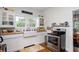 Cozy kitchen with colorful backsplash, farm sink, and stainless steel range at 2003 12Th W Ave, Bradenton, FL 34205