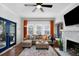 Bright living room with stylish furnishings, colorful rug, and a cozy fireplace at 2003 12Th W Ave, Bradenton, FL 34205