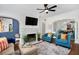 Inviting living room featuring a cozy fireplace, stylish seating, and colorful decor at 2003 12Th W Ave, Bradenton, FL 34205