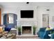 Cozy living room showcasing a decorative fireplace, accent wall, and comfortable seating area at 2003 12Th W Ave, Bradenton, FL 34205