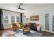 Cozy living room with ceiling fan, lots of natural light, stylish furniture and decor at 2003 12Th W Ave, Bradenton, FL 34205