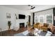Bright living room with fireplace, modern ceiling fan, and lots of natural light at 2003 12Th W Ave, Bradenton, FL 34205
