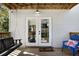 Relaxing porch with swing and comfortable seating, providing a serene outdoor retreat at 2003 12Th W Ave, Bradenton, FL 34205
