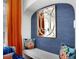Charming reading nook with a built-in bench, accent wall, and designer mirror at 2003 12Th W Ave, Bradenton, FL 34205