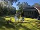 Lush backyard featuring a pair of lawn chairs, and peaceful spot to relax outdoors at 2070 59Th St, Sarasota, FL 34243