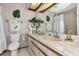 Traditional bathroom showcasing a vanity with a sink and a well-lit mirror at 2070 59Th St, Sarasota, FL 34243