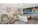 Charming bedroom features stylish furnishings, beach themed decor, and ample natural light at 2070 59Th St, Sarasota, FL 34243