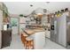 Bright kitchen with a central island, stainless steel appliances, and wood countertops at 2070 59Th St, Sarasota, FL 34243