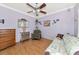 Cozy living room with a ceiling fan, hardwood floors, and a comfortable sofa at 2070 59Th St, Sarasota, FL 34243