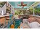 Charming screened porch featuring bamboo accents, decorative accents and outdoor views at 2070 59Th St, Sarasota, FL 34243