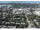 Aerial view of the neighborhood and nearby buildings with a distant waterfront view at 2224 Bahia Vista St # E6, Sarasota, FL 34239