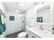 Bathroom featuring a tiled shower, modern vanity, and sleek fixtures at 2224 Bahia Vista St # E6, Sarasota, FL 34239