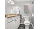 A modern bathroom with granite countertops and a walk-in shower at 2224 Bahia Vista St # E6, Sarasota, FL 34239