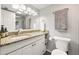 Bright bathroom featuring granite counters, ample storage, and updated fixtures at 2224 Bahia Vista St # E6, Sarasota, FL 34239