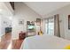 Bedroom with vaulted ceilings and a sliding glass door to balcony at 2224 Bahia Vista St # E6, Sarasota, FL 34239