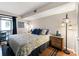 Serene bedroom featuring wood floors, neutral colors, and a sliding door to a balcony at 2224 Bahia Vista St # E6, Sarasota, FL 34239