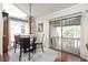 Bright dining area features a sliding glass door to a balcony with a view at 2224 Bahia Vista St # E6, Sarasota, FL 34239