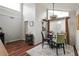 Bright dining area with unique light fixture, large window and sliding door to balcony at 2224 Bahia Vista St # E6, Sarasota, FL 34239