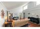 An open-concept living room with hardwood floors, a vaulted ceiling, and stylish furnishings at 2224 Bahia Vista St # E6, Sarasota, FL 34239