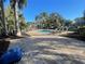 Community pool with lounge chairs and palm trees on sunny day at 2224 Bahia Vista St # E6, Sarasota, FL 34239