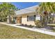 Charming home featuring a welcoming entrance and lovely landscaping at 2403 Aspinwall St, Sarasota, FL 34237