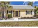Charming home featuring a neutral exterior, trimmed windows and a well-manicured lawn at 2403 Aspinwall St, Sarasota, FL 34237