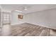Inviting living room showcasing new floors, modern lighting, and an open view to the kitchen at 2403 Aspinwall St, Sarasota, FL 34237