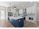 Modern kitchen with white cabinetry, stainless steel appliances, and a stylish island with a sink at 2523 Dixon Ter, Port Charlotte, FL 33981