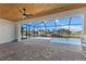 Screened lanai featuring an outdoor kitchen and pool overlooking a canal view at 2523 Dixon Ter, Port Charlotte, FL 33981